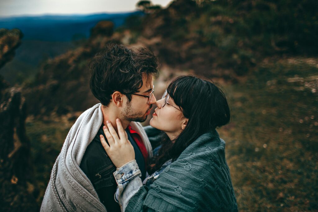 pexels-photo-2055224-2055224 Young couple sharing an intimate embrace in a scenic outdoor setting in Brazil, showcasing love and romance.